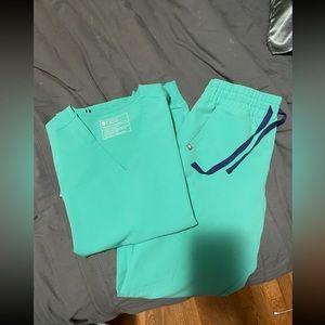 Women’s surgical green scrubs.